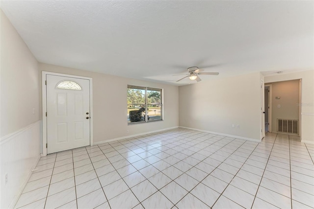 tiled entrance foyer featuring ceiling fan