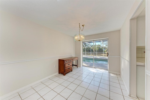 unfurnished dining area featuring light tile patterned floors and a notable chandelier