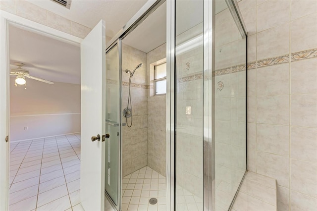 bathroom with ceiling fan, tile patterned floors, and walk in shower