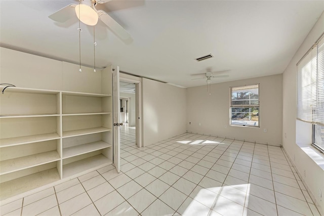 empty room with light tile patterned floors