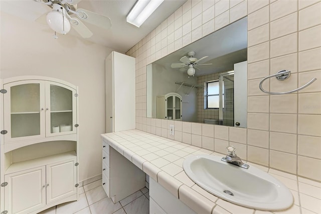 bathroom featuring ceiling fan, decorative backsplash, tile patterned floors, and vanity