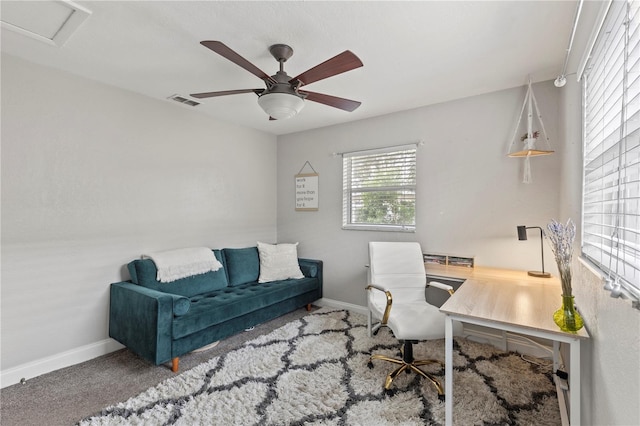 office area featuring attic access, carpet, ceiling fan, and baseboards