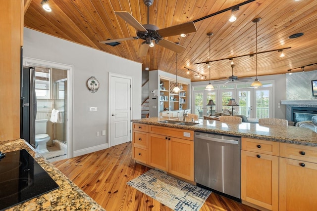 kitchen with sink, light stone countertops, appliances with stainless steel finishes, french doors, and wooden ceiling