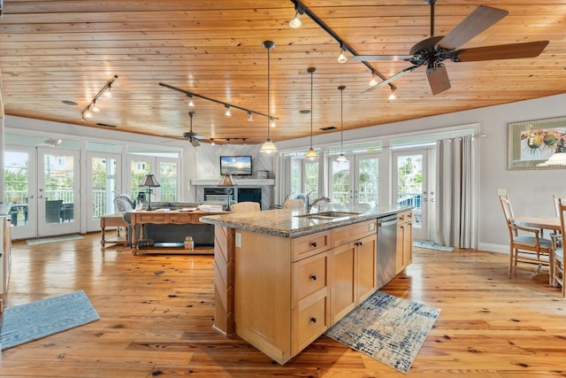 kitchen featuring french doors, light brown cabinetry, light stone counters, wooden ceiling, and a center island with sink