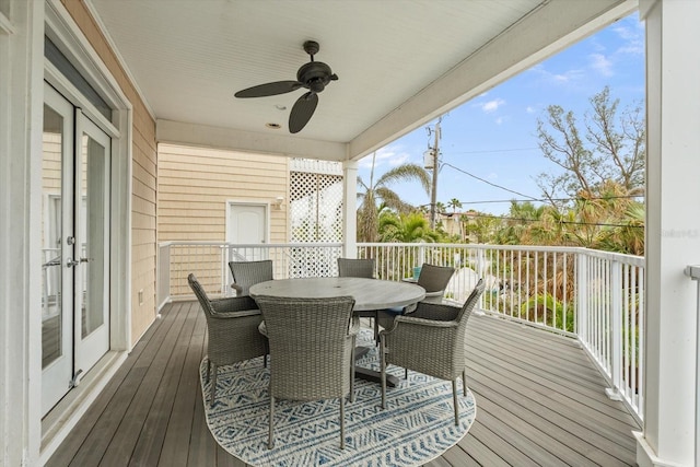 wooden terrace with ceiling fan and french doors