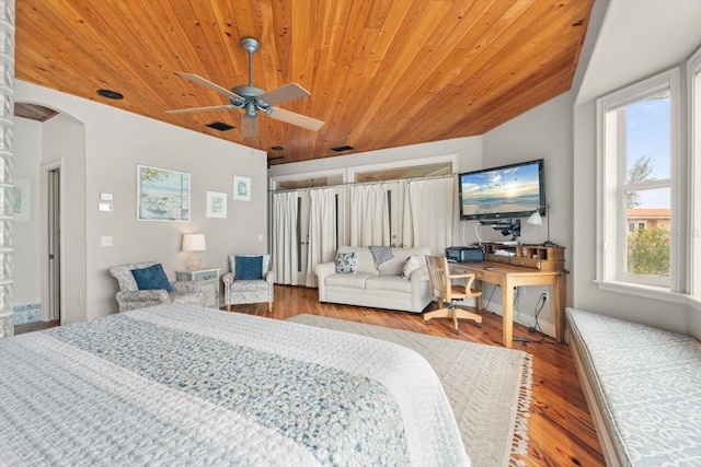 bedroom with ceiling fan, hardwood / wood-style flooring, and wooden ceiling