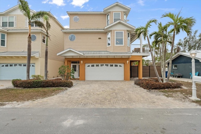 view of front of house with a balcony and a garage