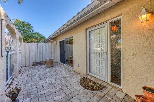 doorway to property featuring a patio area