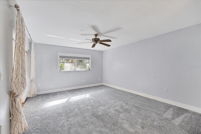 spare room with ceiling fan and carpet floors