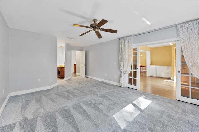 carpeted empty room with ceiling fan