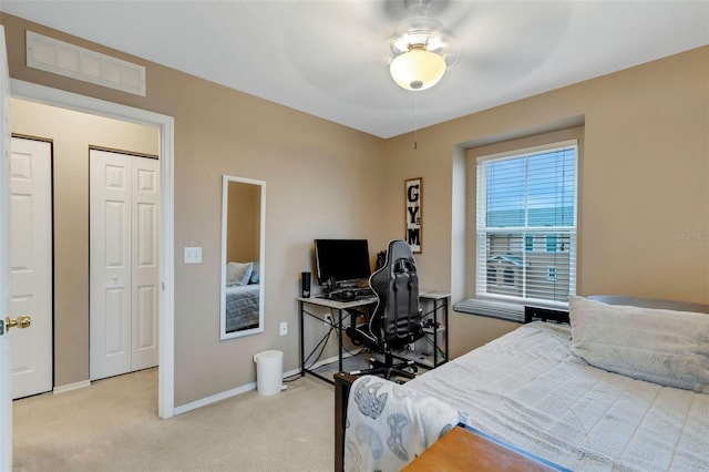 bedroom featuring ceiling fan and light carpet