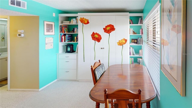 view of carpeted dining space