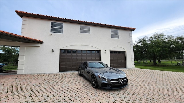 view of property exterior with a garage