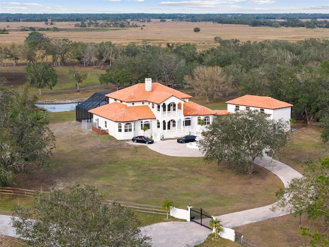 birds eye view of property featuring a water view and a rural view