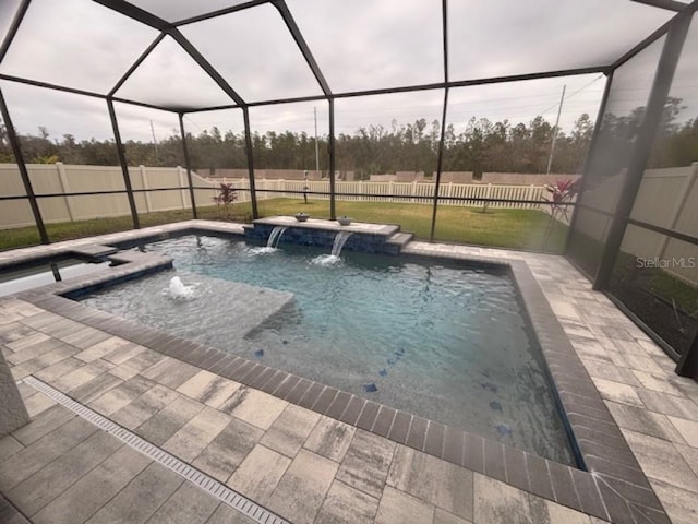 view of swimming pool with pool water feature, a jacuzzi, a patio, and glass enclosure