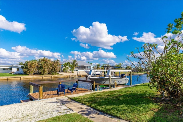 view of dock featuring a water view and a lawn