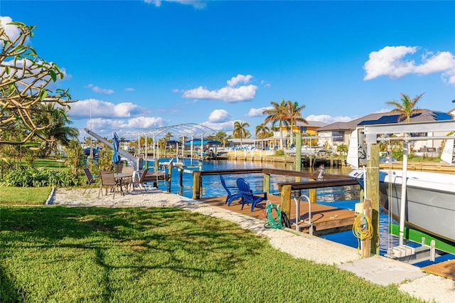 dock area featuring a lawn and a water view