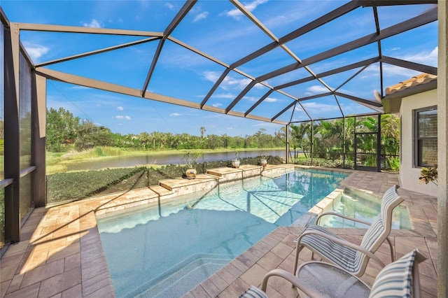 view of pool with a water view, a patio area, and glass enclosure