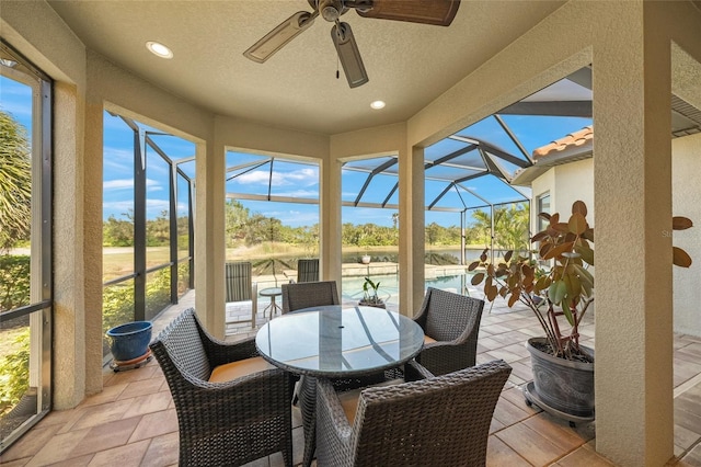 sunroom with plenty of natural light and ceiling fan