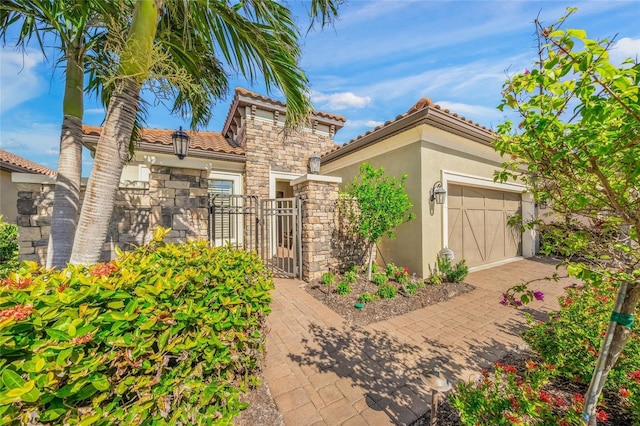 mediterranean / spanish-style house featuring a garage