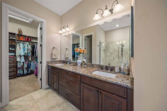 bathroom featuring an enclosed shower and vanity