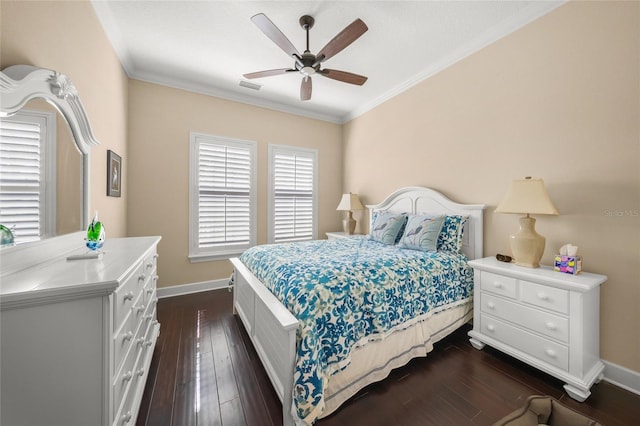 bedroom with ceiling fan, ornamental molding, and dark hardwood / wood-style floors