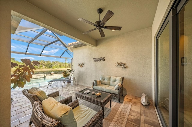 view of patio / terrace featuring a lanai, an outdoor hangout area, and ceiling fan