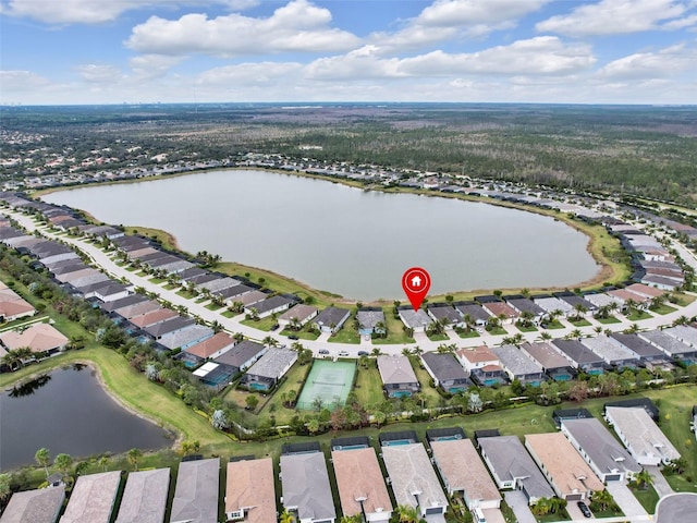 drone / aerial view with a residential view and a water view