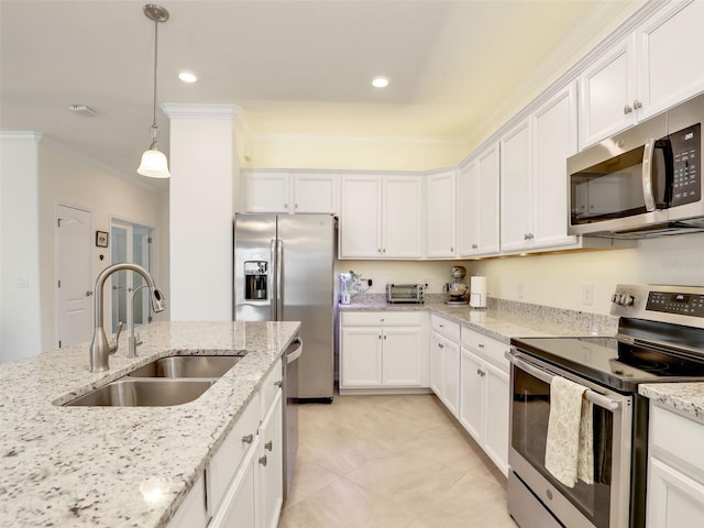 kitchen featuring white cabinetry, appliances with stainless steel finishes, a sink, and ornamental molding