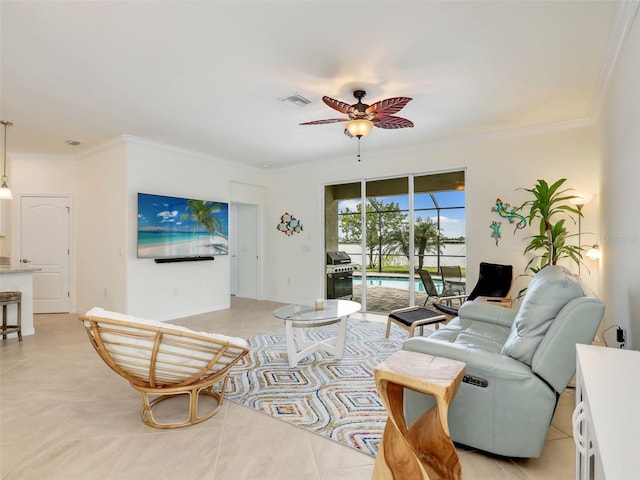 living room featuring light tile patterned floors, ornamental molding, visible vents, and a ceiling fan