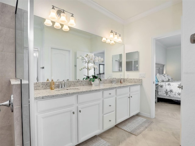 ensuite bathroom featuring double vanity, a sink, and crown molding