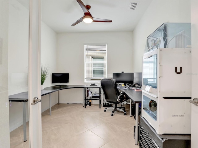 office with light tile patterned floors, ceiling fan, and visible vents