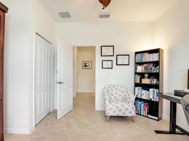 sitting room with visible vents, baseboards, and light tile patterned flooring