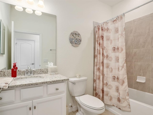 bathroom featuring shower / tub combo, vanity, and toilet