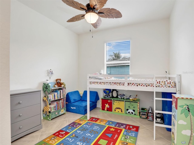 playroom featuring ceiling fan and tile patterned floors