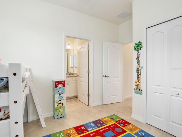 game room featuring light tile patterned floors, baseboards, visible vents, and a sink