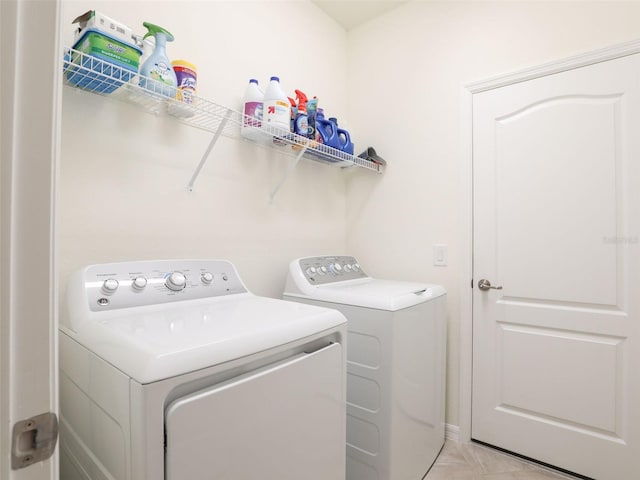 washroom featuring laundry area and washer and clothes dryer