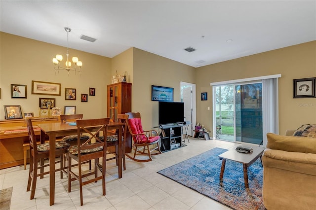 tiled living room featuring a notable chandelier