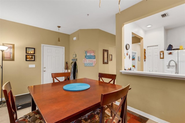 dining space featuring light tile patterned flooring