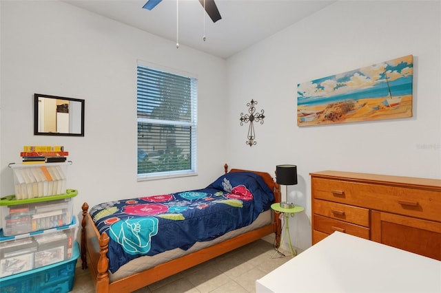 bedroom with light tile patterned flooring and ceiling fan