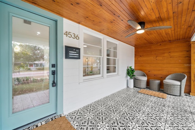 interior space featuring covered porch and ceiling fan