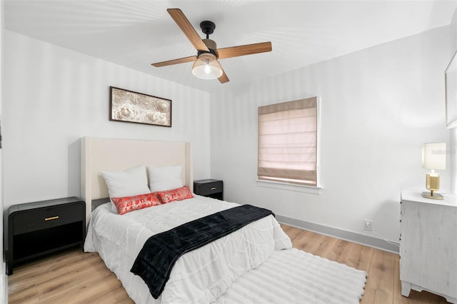 bedroom with light wood-type flooring and ceiling fan