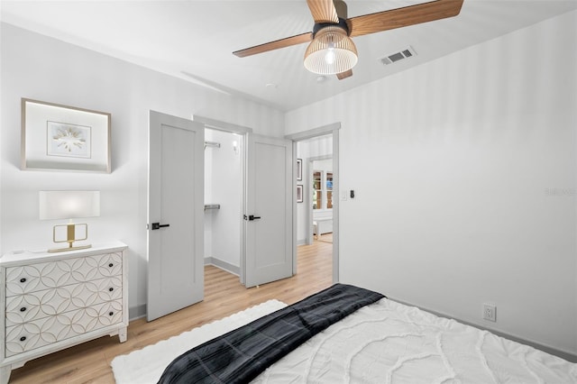 bedroom featuring light wood-type flooring and ceiling fan