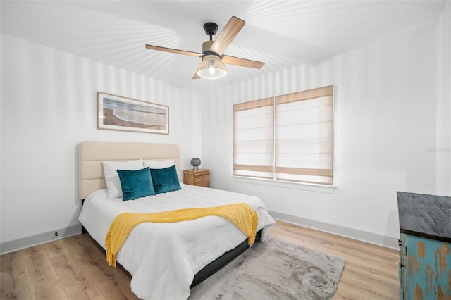 bedroom featuring ceiling fan and light wood-type flooring