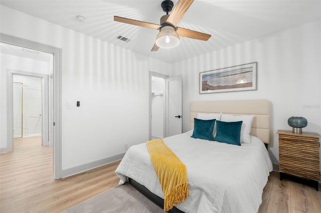 bedroom with light wood-type flooring and ceiling fan