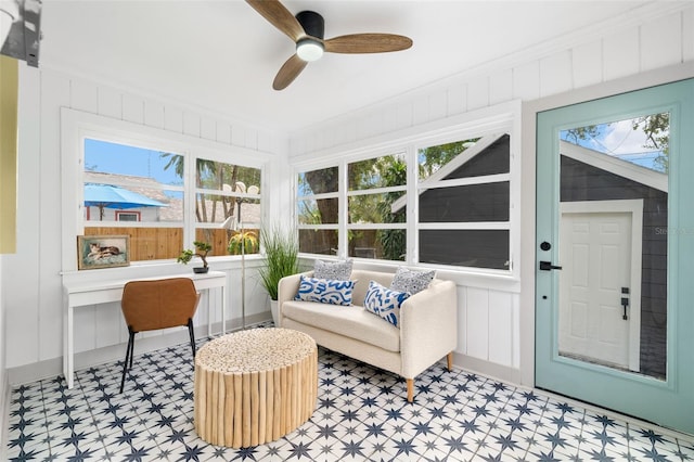 sunroom / solarium with ceiling fan and plenty of natural light