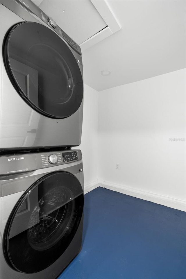 laundry room with stacked washer and clothes dryer