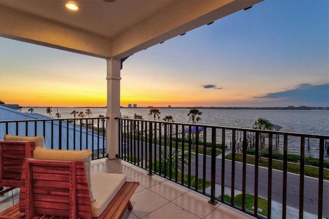 balcony at dusk with a water view