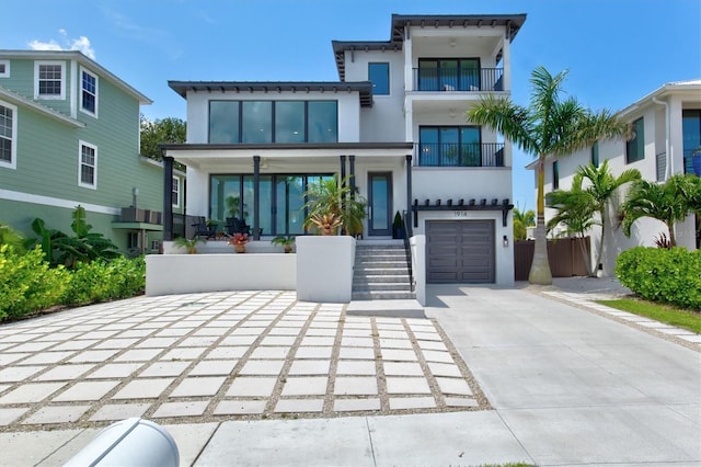 rear view of property featuring a garage