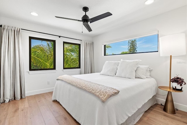 bedroom featuring ceiling fan and light hardwood / wood-style floors